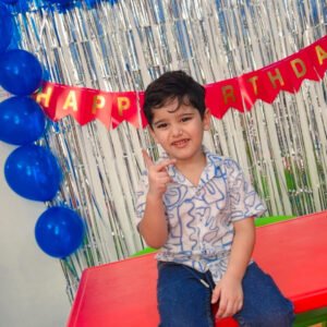 Colorful birthday cake and decorations at a preschool birthday event