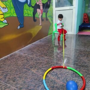Child doing balance and coordination activity indoors