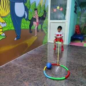Kid enjoying obstacle play activity in preschool