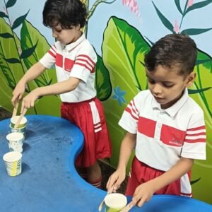 Child enjoying toy ring and ball indoor preschool activity