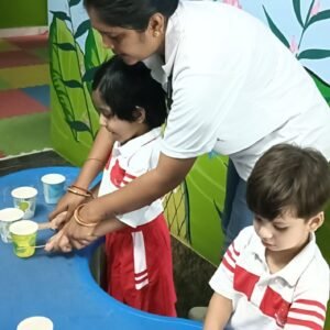 Preschool children doing creative indoor play activity