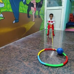 Child enjoying rope activity game in preschool classroom