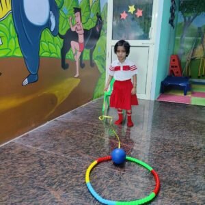 Preschool child playing indoor ball and ring activity at BrainBunny Juniors
