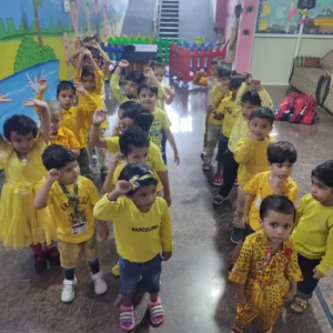 Little learners dressed in yellow during colour recognition activity at BrainBunny Juniors Gurugram