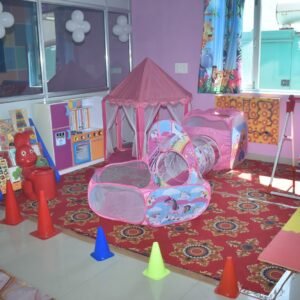 Teacher guiding students through an early learning activity.